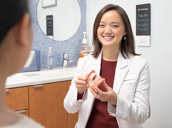 Manhattan Bridge Orthodontics Dr. Jenny Zhu consult with patient