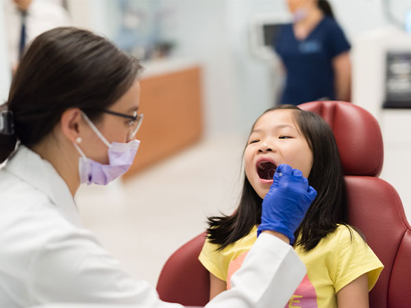 Manhattan Bridge Orthodontics Dr. Jenny Zhu seeing a young patient