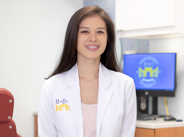 Manhattan Bridge Orthodontics Dr. Kimberly Bui smiling happily